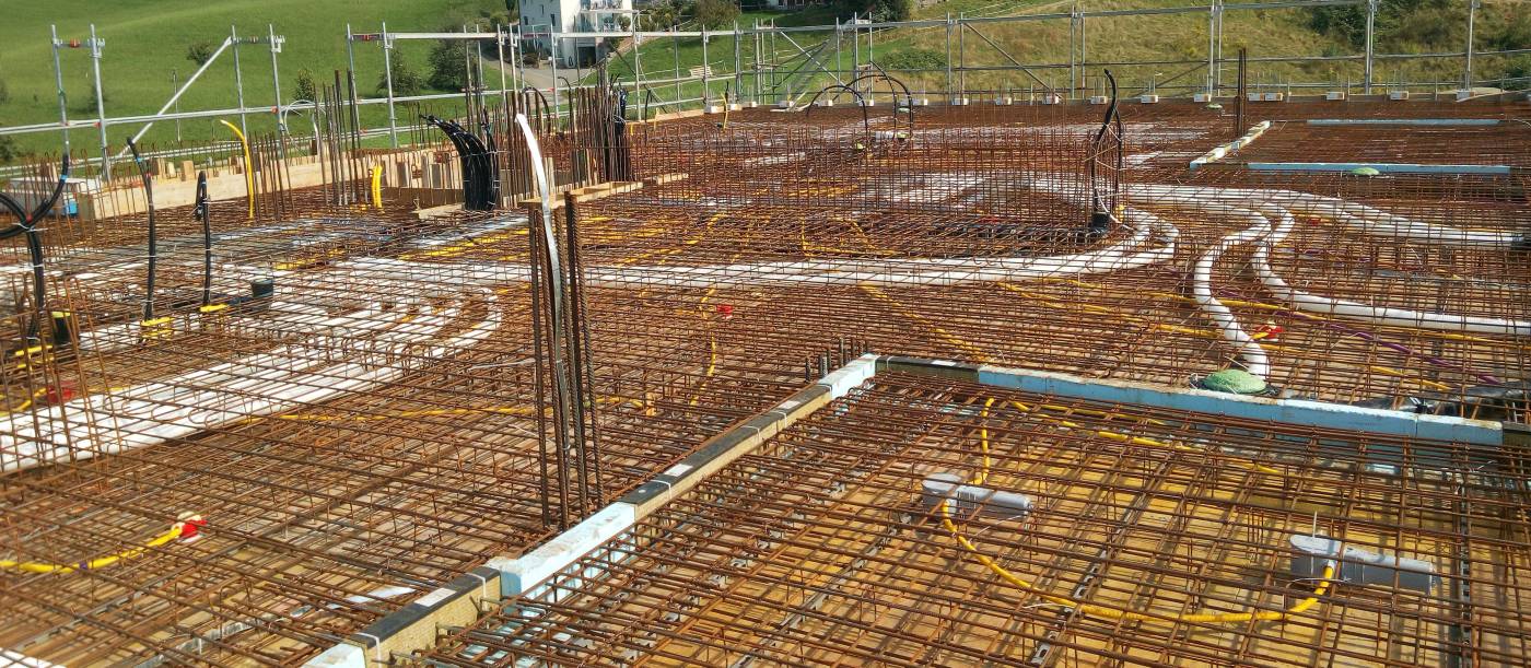 Wohn- und Gewerbegebäude Ortskern, Honau 1.Etappe, Baugrube, Baugrubensicherung, Werkleitung und Kanalisation, Tragwerksplanung, Baukontrollen